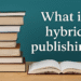 Stack of books with an open book and the question "What is hybrid publishing?" representing the concept of modern and traditional publishing merging