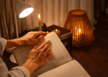 Open book with glowing pages representing the illumination of narrative meaning through ambiguous storytelling