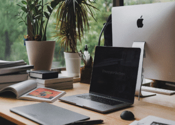 organized desk in morning sunlight with notebook and peaceful workspace, exemplifying the discipline and clarity of early morning writing sessions